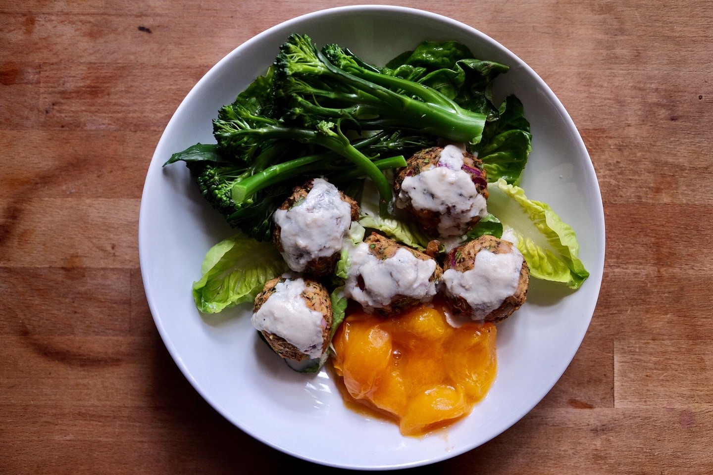 baked blackeye bean balls with steamed brocolli and salad