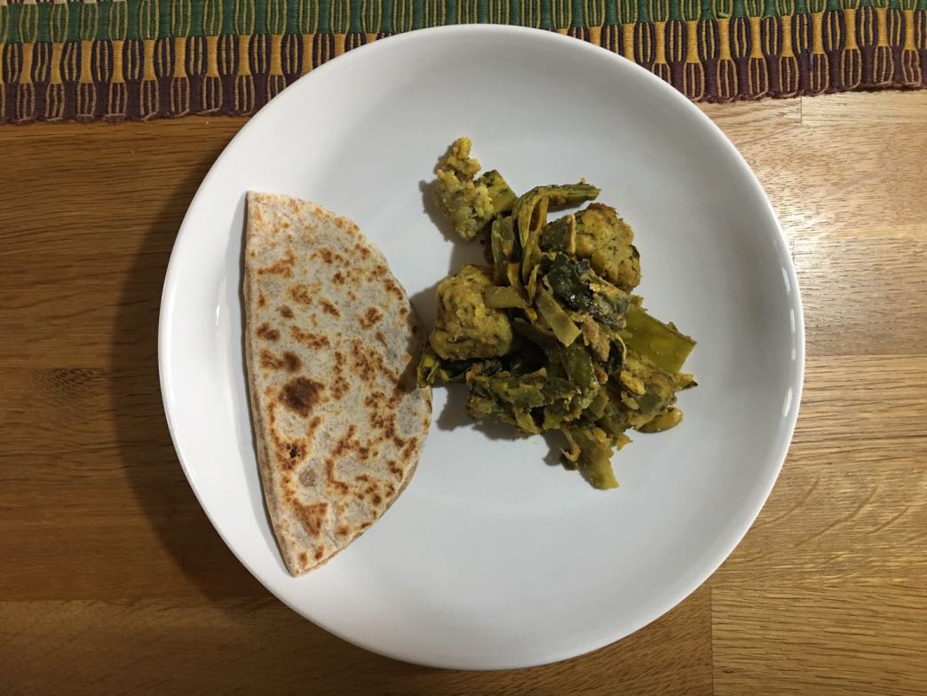 Stuffed chapati with a spicy curry