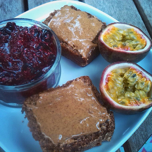 chia berry jam pudding almond butter on toasted sprouted rye passion fruit