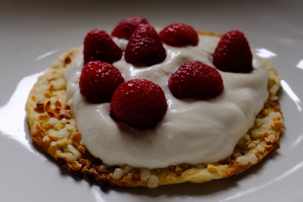 tortas biscuits with soya yogurt and fresh raspberries